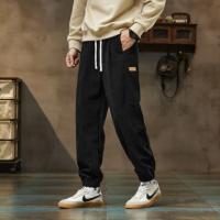 唐狮2026秋季新款休闲长裤男士束脚裤黑色时尚百搭松紧腰宽松男裤